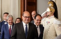 Democratic Party leader Nicola Zingaretti, center, leaves after meeting Italian President Sergio Mattarella, in Rome, Aug. 22, 2019. Mattarella was receiving political leaders to explore whether a majority exists in Parliament for a new government.