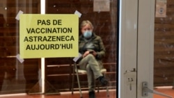 A man waits in a vaccination center where a sign reads "No AstraZeneca vaccinations today" in Saint-Jean-de-Luz, southwestern France, Tuesday, March 16, 2021. With coronavirus cases rising in many places, governments faced the grimmest of dilemmas…