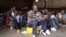 Men sit in the Gikondo transit center in Kigali, Sept. 24, 2015. Human Rights Watch accused the Rwanda government of rounding up "undesirables," including beggars and prostitutes, and holding them in the center to promote the capital's clean image, a charge denied by the government.