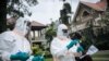 Staff members of the Congolese Ministry of Health perform a COVID-19 test at a private residence in Goma, northeastern Democratic Republic of Congo, on March 31, 2020. 