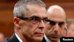 FILE - Canadian Security Intelligence Service (CSIS) director Michel Coulombe (L) waits to testify before the Commons public safety and national security committee on Parliament Hill in Ottawa, Oct. 8, 2014.