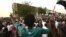 Sudanese protesters rally outside the army headquarters in Khartoum, May 4, 2019, to demand that the ruling military council hand power to a civilian administration.