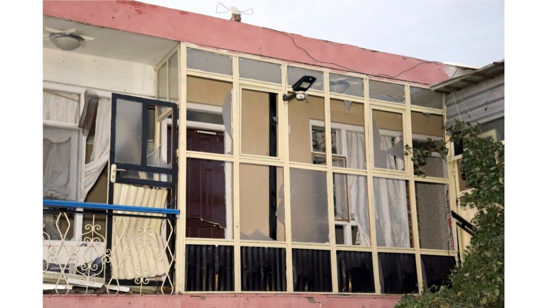 A broken window of a house is seen after US drone strike in Kabul, Aug. 29, 2021.