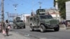 Armored vehicles of the Kenyan peace-keeping mission patrol as residents flee their neighborhood due to gang violence, in Port-au-Prince, Haiti, Feb. 25, 2025. 