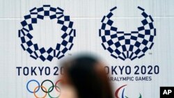 지난 2일 일본 도쿄 거리에 올림픽 홍보 포스터가 붙어있다.