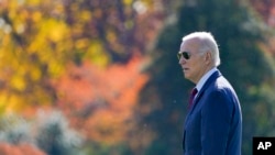 FILE —President Joe Biden walks across the South Lawn of the White House in Washington, November 14, 2023, to board Marine One as he heads to San Francisco for the Asia-Pacific Economic Cooperation summit.