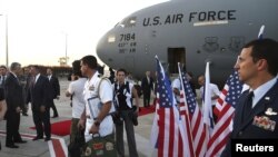 U.S. Secretary of Defense Leon Panetta (2nd L) is welcomed after arriving in Tel Aviv, Israel July 31, 2012. 