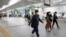 People walk at quiet Yokohama station in Yokohama, Kanagawa prefecture, near Tokyo, May 21, 2020. 