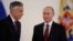 U.S. Ambassador Jon Huntsman, left, walks after presenting credentials to Russian President Vladimir Putin during a ceremony in the Kremlin, in Moscow, Russia, Oct. 3, 2017.