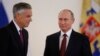 U.S. Ambassador Jon Huntsman, left, walks after presenting credentials to Russian President Vladimir Putin during a ceremony in the Kremlin, in Moscow, Russia, Oct. 3, 2017.