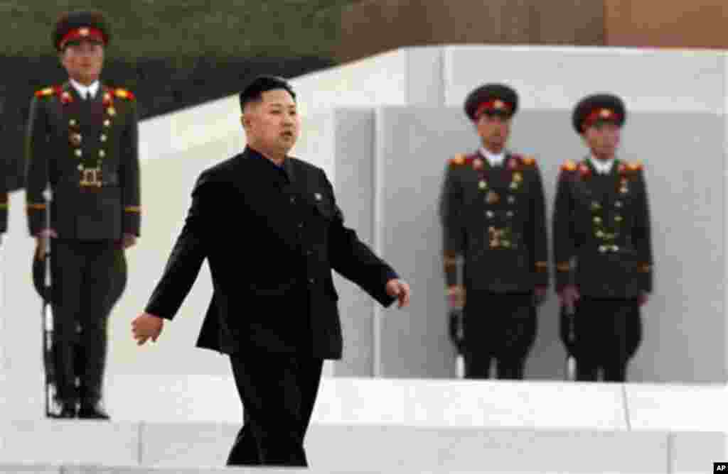 North Korean leader Kim Jong Un arrives for the unveiling ceremony for statues of late leaders Kim Jong Il and Kim Il Sung on Mansudae in Pyongyang, North Korea, Friday, April 13, 2012. (AP Photo/Ng Han Guan)