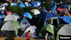 Migrants, most of them asylum-seekers sent back to Mexico from the U.S. under the "Remain in Mexico" program, officially named Migrant Protection Protocols (MPP), occupy a makeshift encampment in Matamoros, Tamaulipas, Mexico, Oct. 28, 2019.