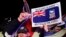 Falkland Islanders react after hearing the results of the referendum in Stanley, March 11, 2013.