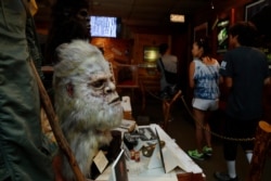 This Aug. 8, 2019, photo shows a Bigfoot mask on display at Expedition: Bigfoot!, The Sasquatch Museum in Cherry Log, Georgia.
