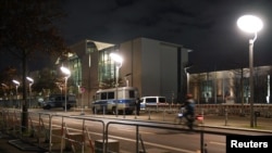 A general view of the Chancellery with security bars and police cars, the host of the Libya summit in Berlin, Germany, Jan. 18, 2020.