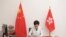 Handout picture of Hong Kong Chief Executive Carrie Lam signing the promulgation of the National Security Law, July 1, 2020.