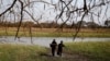 FILE - Rebel fighters collect water to drink from a swamp in a rebel camp in Jonglei State.