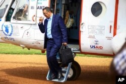 FILE - World Health Organization Director-General Tedros Adhanom Ghebreyesus arrives by helicopter at Ruhenda airport in Butembo, eastern Congo, June 15, 2019.