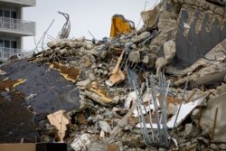 FILE - The rubble of the collapsed building Champlain tower is seen in Surfside, Florida, July 6, 2021.
