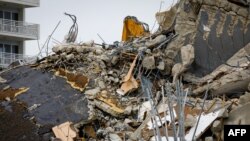 The rubble of the collapsed building Champlain tower is seen in Surfside, Florida, July 6, 2021. 