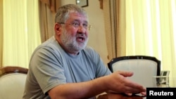 FILE - Ukrainian billionaire Ihor Kolomoisky speaks during an interview in Dnipropetrovsk, Ukraine, May 24, 2014.