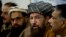 FILE - Pakistani religious cleric, Sami-ul-Haq, second right, addresses a news conference with, Hameed Gul, former chief of Pakistan's intelligence, left, in Islamabad, Pakistan.