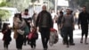 Palestinians walk with their belongings to safer areas in the Nuseirat camp in the central Gaza Strip, on Nov. 28, 2024, amid the ongoing war in the Palestinian territory between Israel and Hamas.