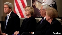 U.S. Secretary of State John Kerry (L) and former secretaries of State Hillary Clinton, Colin Powell and Madeleine Albright (R) attend a reception celebrating the completion of the U.S. Diplomacy Center Pavilion in Washington, Jan. 10, 2017. 