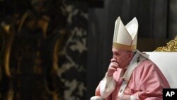 Pope Francis celebrates mass on the occasion of 500 years of Christianity in the Philippines, in St. Peter's Basilica, at the Vatican, Sunday, March 14, 2021. (Tiziana Fabi/Pool photo via AP)