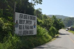 A sign in the Zapatista zone with a message that reads in Spanish: ¨You are in the Zapatista rebel territory. Here the people rule and the government obeys.," warns visitors in Chiapas, México, July 6, 2019.