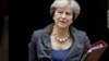 Dos hombres que planeaban lanzar algún tipo de artefacto explosivo improvisado contra la residencia de la primera ministra Theresa May, .han sido capturados