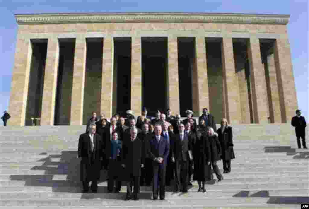 U.S. Vice President Joe Biden, front center, is surrounded by U.S officials during a wreath laying ceremony at the mausoleum of Kemal Ataturk, the founder of modern Turkey, in Ankara, Turkey, Friday, Dec. 2, 2011. Biden called on Turkey to impose new sanc