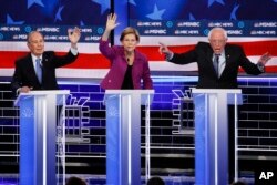 FILE - From left, Democratic presidential candidates, former New York City Mayor Mike Bloomberg, Sen. Elizabeth Warren, D-Mass., Sen. Bernie Sanders, I-Vt., participate in a Democratic presidential primary debate in Las Vegas, Feb. 19, 2020.