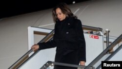 U.S. Vice President Kamala Harris disembarks from Air Force Two upon arrival at Warsaw Chopin Airport, in Warsaw