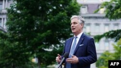 FILE - National Security Advisor Robert O'Brien speaks to reporters outside of the West Wing of the White House in Washington, May 21, 2020.