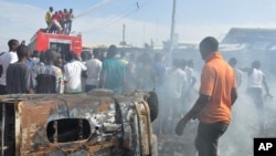 Un de récents attentats à la bombe à Maiduguri, Nigeria, 26 Novembre 2014.