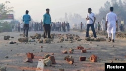 Activists of Jamaat-e-Islami, Bangladesh's biggest Islamist party, stand during a clash with police in Chittagong, Feb. 28, 2013. 