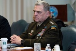 FILE - In this Sept. 22, 2020, file photo Joint Chiefs Chairman Gen. Mark Milley listens before a meeting at the Pentagon in Washington.