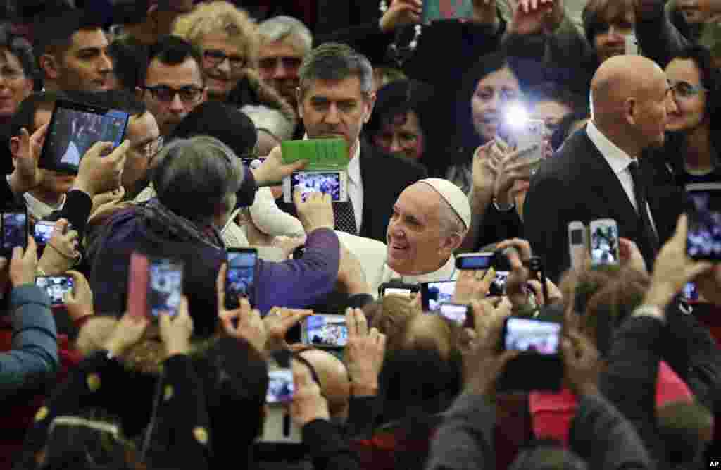 Pope Francis arrives for an audience with residents of the areas of central Italy hit by earthquakes, in the Pope Paul IV hall, at the Vatican.