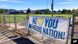 A banner thanking supporters of Newberg schools is seen Sept. 21, 2021, next to the athletic fields of Newberg High School, in Newberg, Ore. 