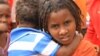 A child holds another refugee in Kenya’s Dadaab refugee camp, Sept. 20, 2016. 