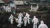 Members of the Congolese Red Cross and the Civilian Protection group bury dozens of bodies in a cemetery in Goma on Feb. 3, 2025.