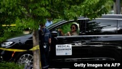  A medical examiner arrives at a scene where a man was killed during an arrest attempt on June 3, 2021, in Minneapolis, Minnesota.
