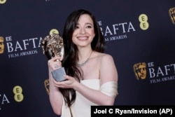 Mikey Madison poses with the leading actress award for 'Anora' at the 78th British Academy Film Awards, BAFTA's, in London, Feb. 16, 2025.