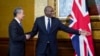 Britain's Foreign Secretary David Lammy, right, welcomes Chinese Foreign Minister Wang Yi ahead of a meeting in London, Feb. 13, 2025. (James Manning/Pool Photo via AP)