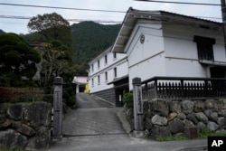 This photo shows Ozawa Sake Brewery, who makes "Sawanoi," a Japanese sake brand, in Ome, on the western outskirts of Tokyo, Japan, Wednesday, Nov. 13, 2024. (AP Photo/Hiro Komae)