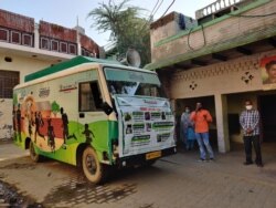 This van mounted with a loudspeaker helps a teacher take a lesson from the street in Kanwarsika village. (Anjana Pasricha/VOA)