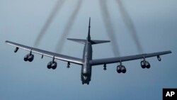 FILE - This Air Force photo shows a B-52H Stratofortress, May 21, 2019. Two of these bombers have flown over a swath of the Middle East, sending what U.S. officials say is a message of deterrence to Iran.