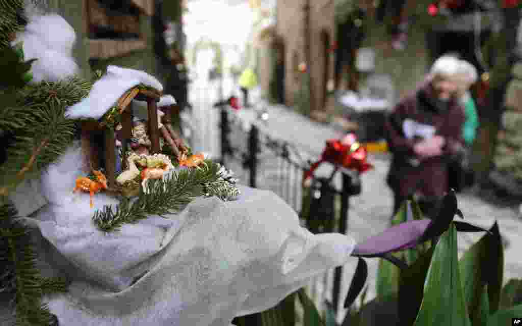 A crib is displayed in Luceram, southeastern France, as part of the Circuit des Creches exhibition of several hundred manger scenes depicting the Christian nativity annually displayed in the streets of the medieval mountain village, north of Nice.