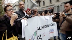 Journalists stage a protest, Nov. 13, 2018 in Milan and across Italy against insults from prominent figures in the governing 5-Star Movement.